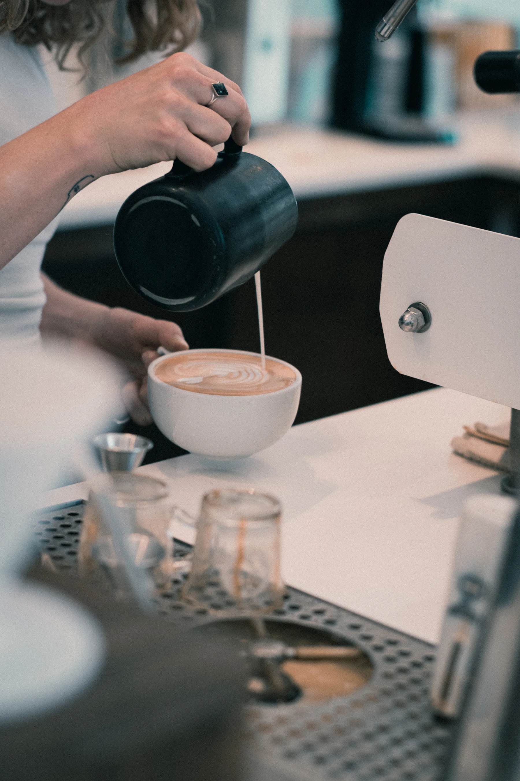 Milk being poured into an espresso
