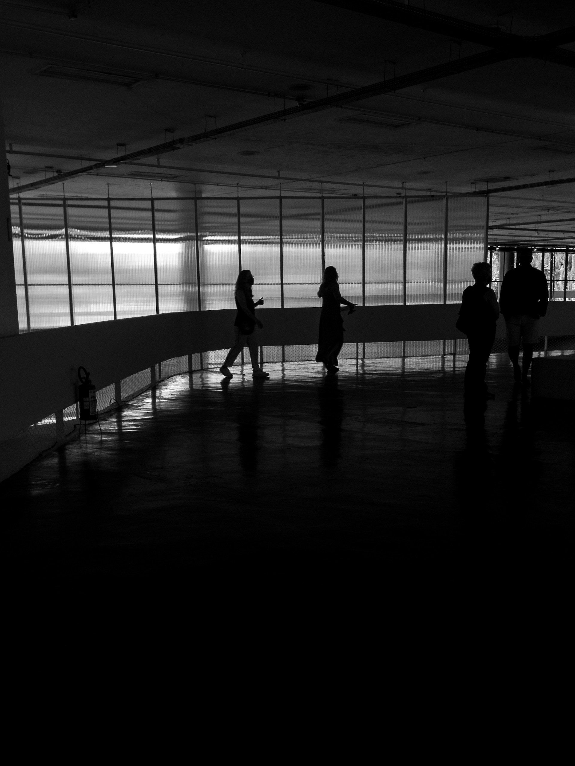 a group of people standing in a dark room