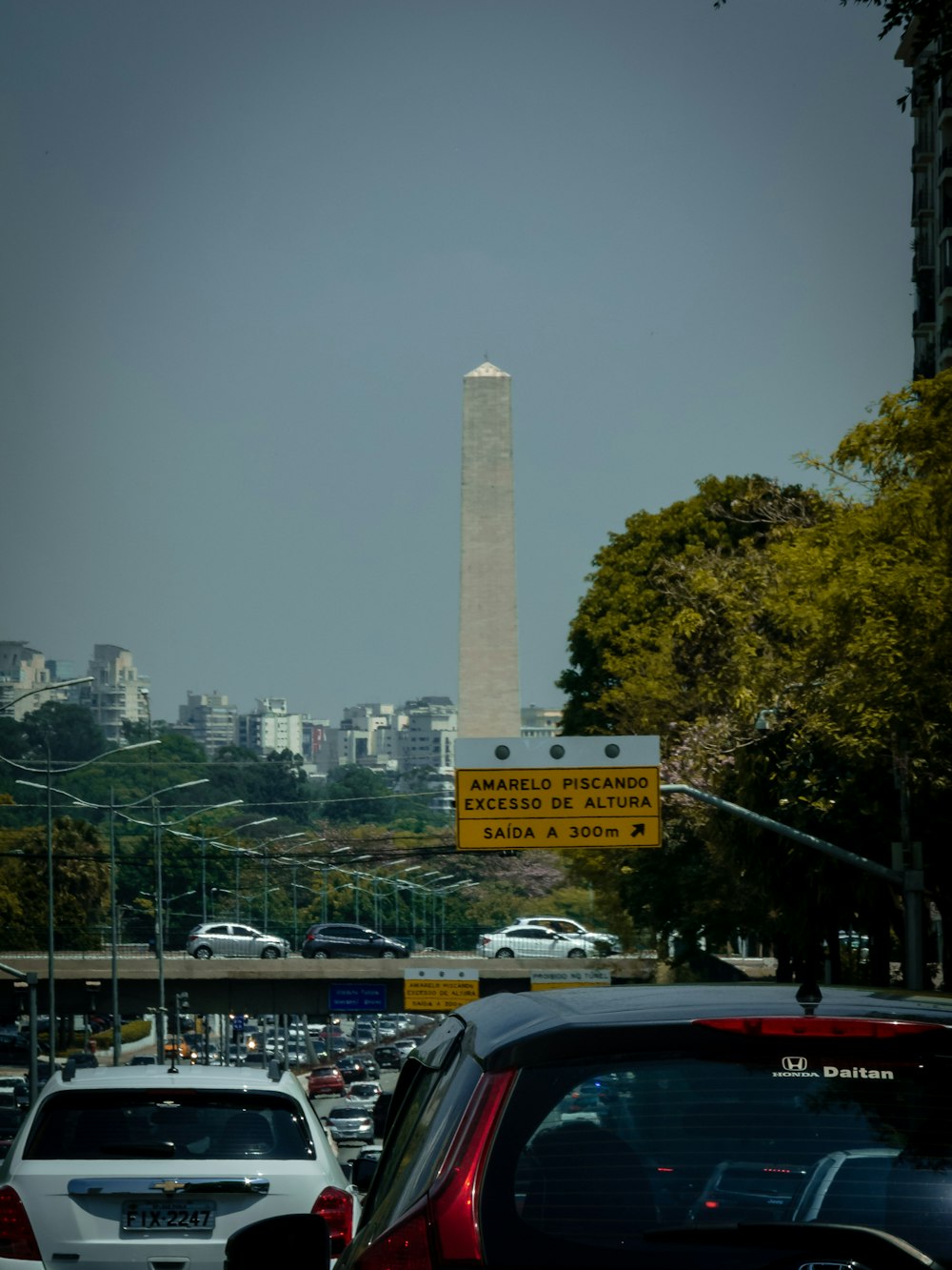 a view of the washington monument from a busy street