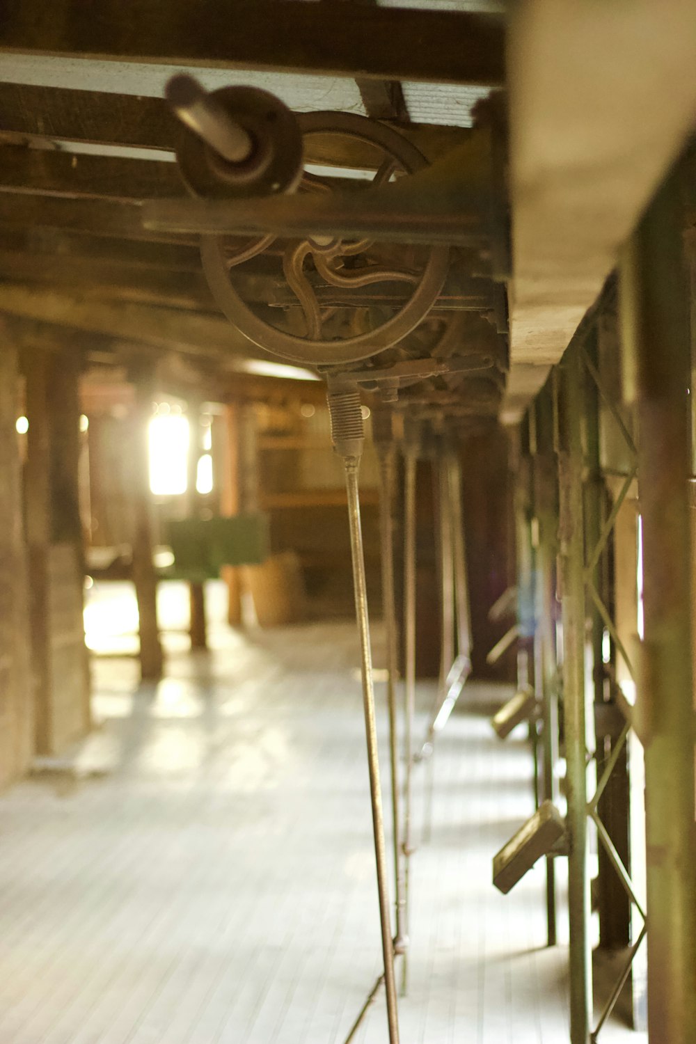 a row of benches sitting on top of a wooden floor