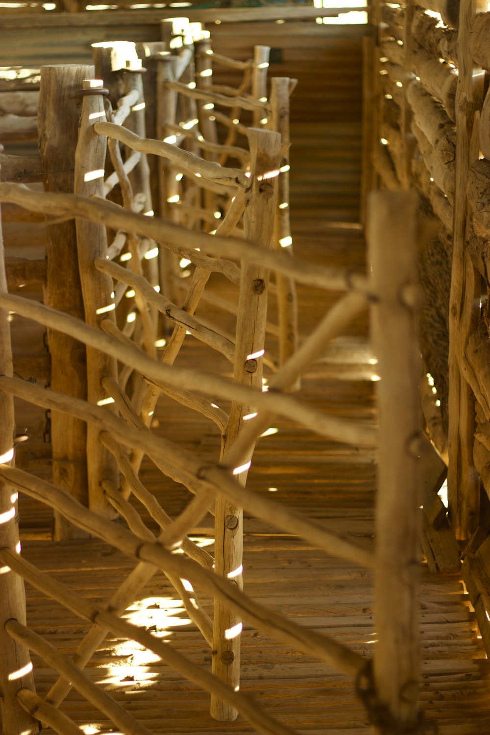 a row of wooden chairs sitting on top of a wooden floor