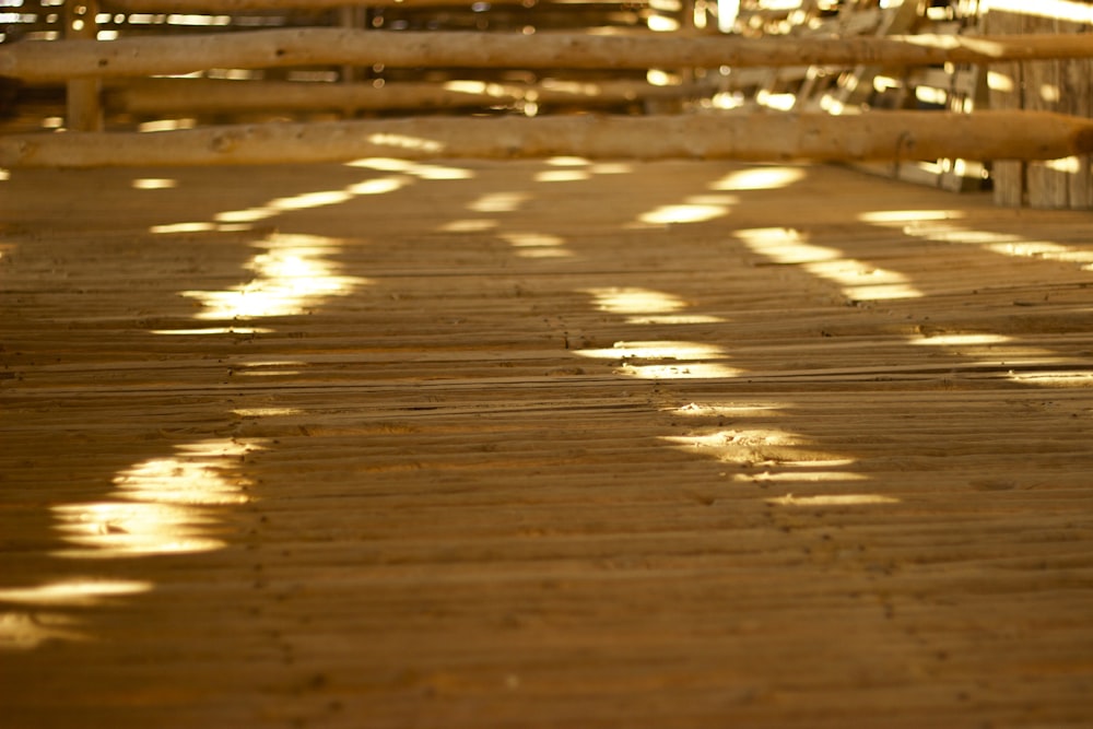 the sun is shining through the slats on the floor