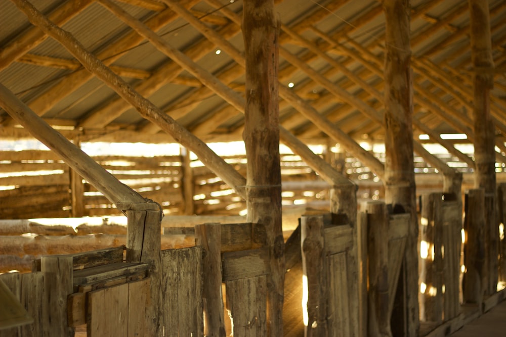 a row of wooden posts in a building