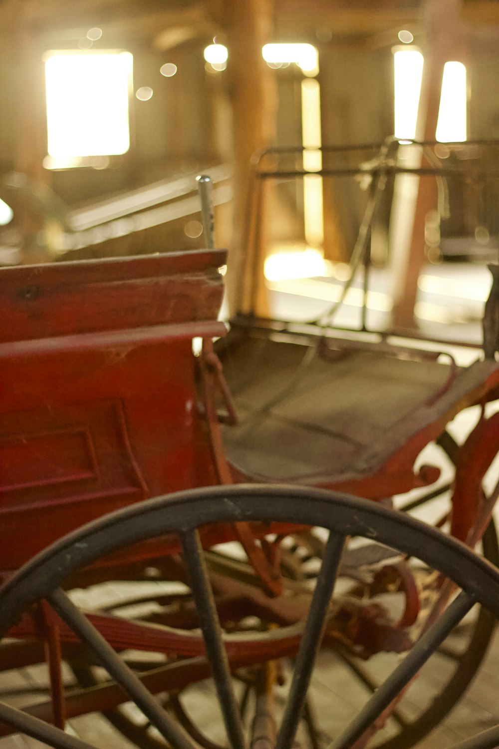 a horse drawn carriage sitting inside of a building