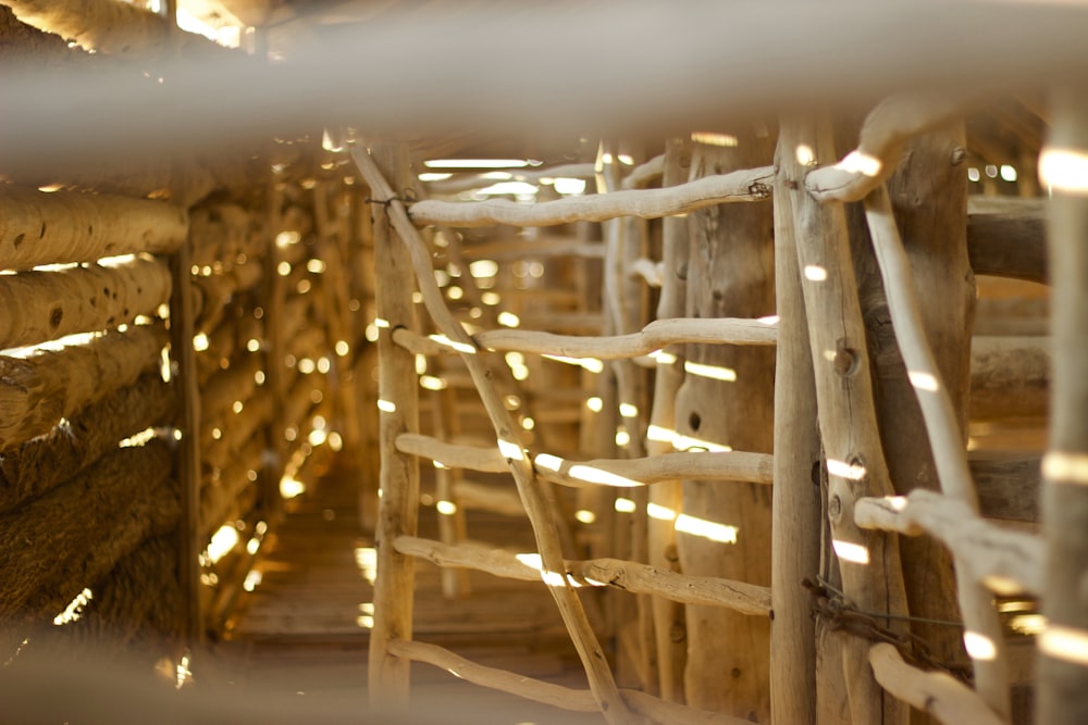 a close up of a wooden fence with lights on it