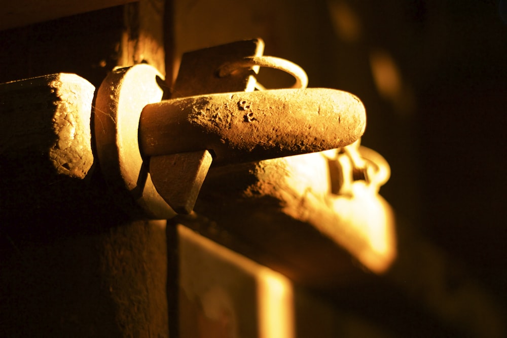 a close up of a door handle on a wooden door