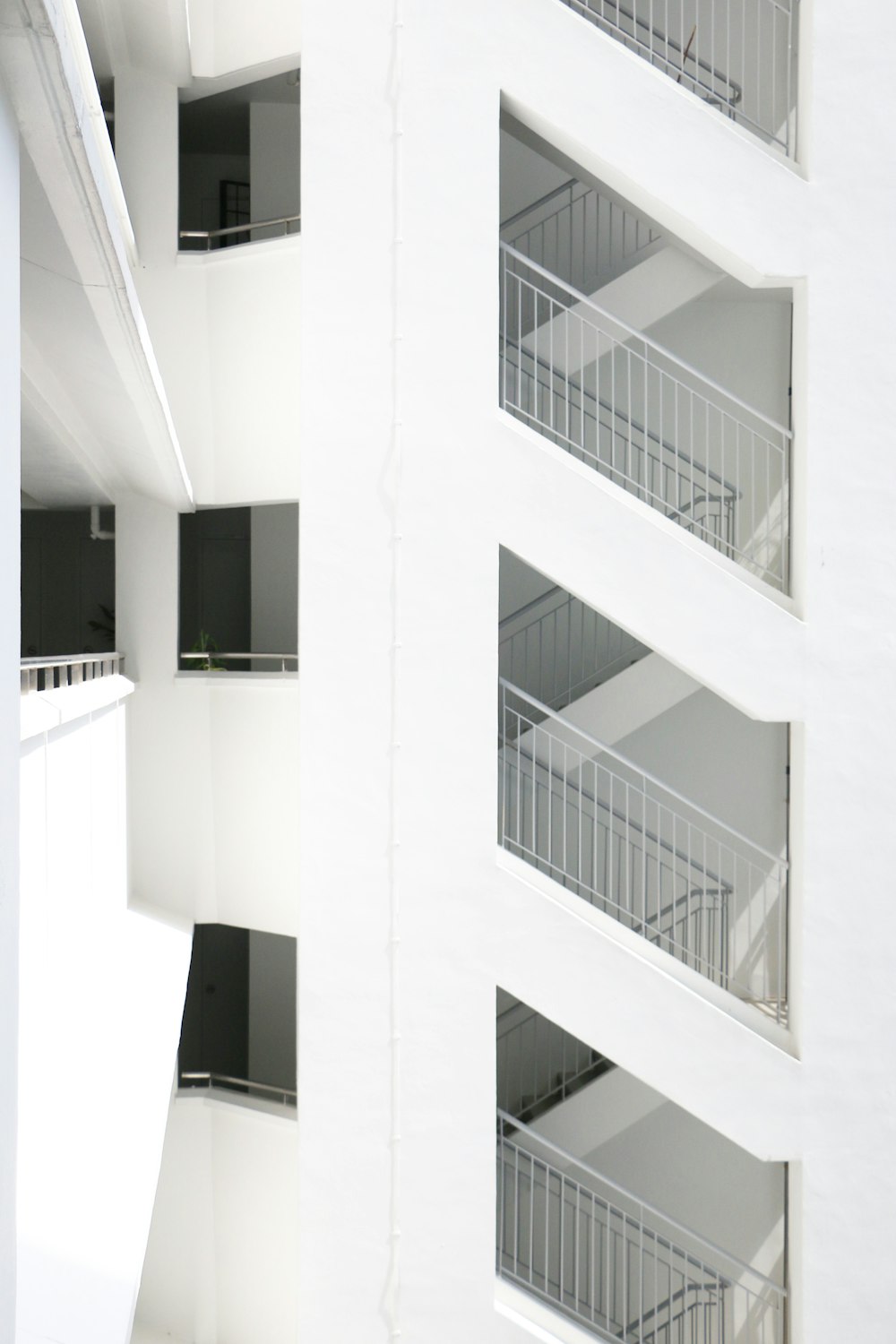 a white building with balconies and balconies