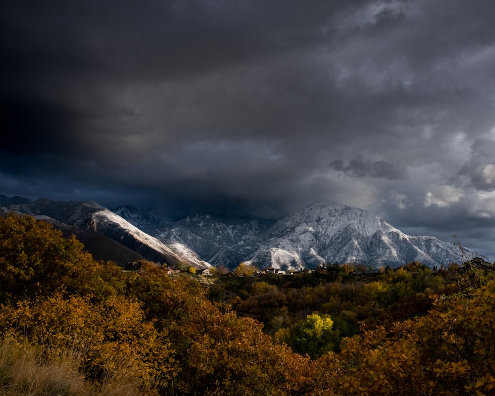 a view of a mountain range under a cloudy sky