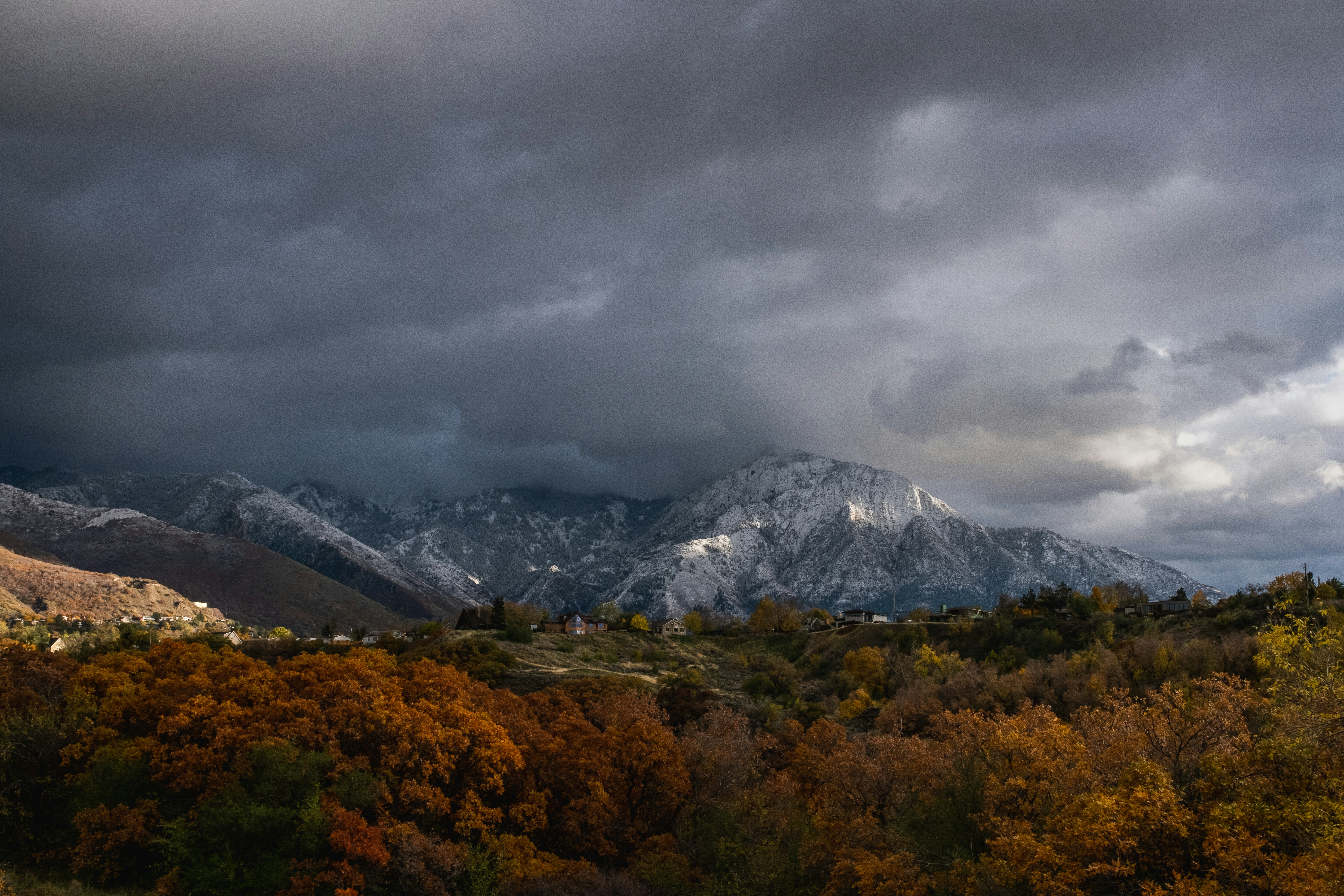 a view of a mountain range under a cloudy sky