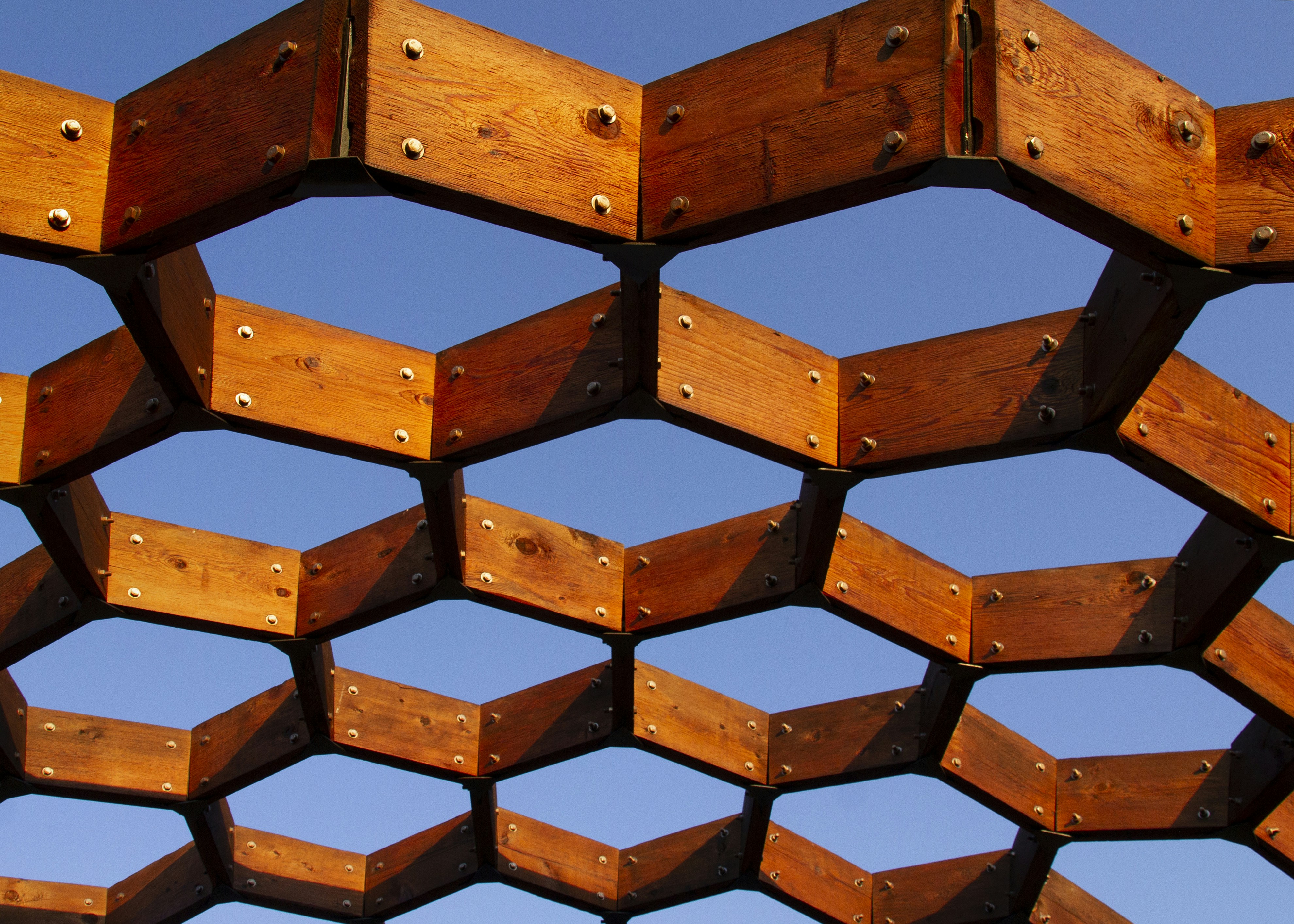 a close up of a wooden structure with rivets