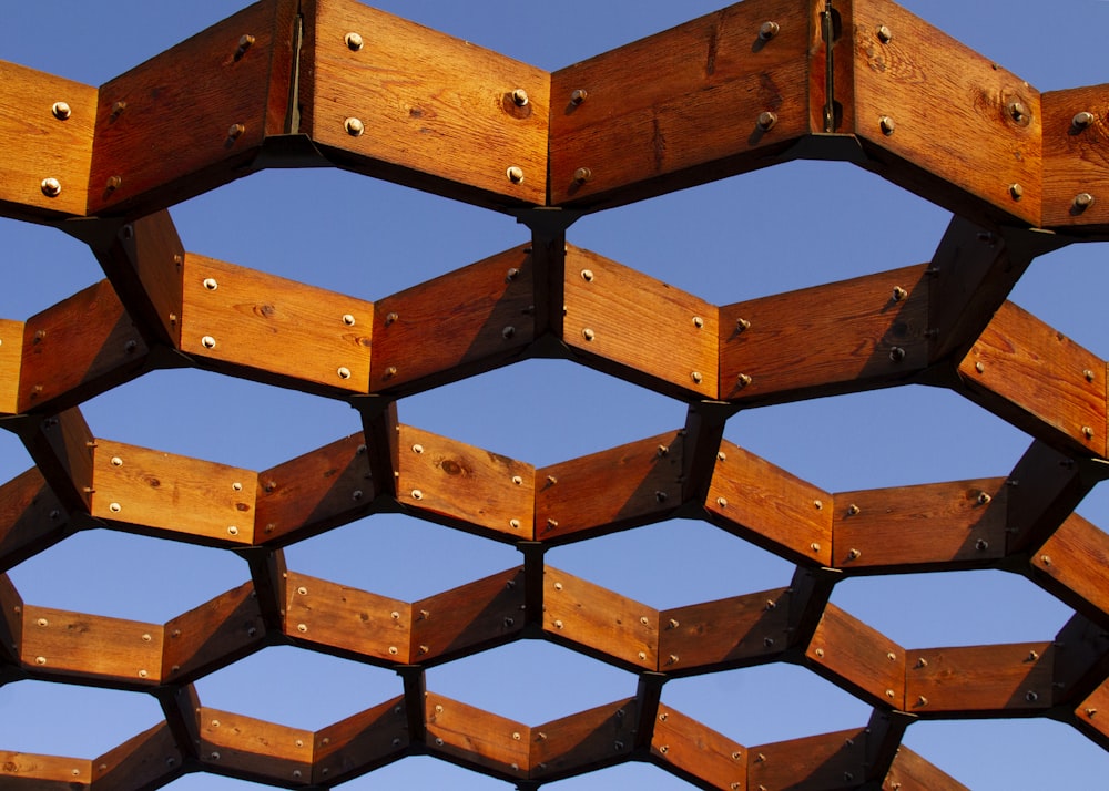 a close up of a wooden structure with rivets