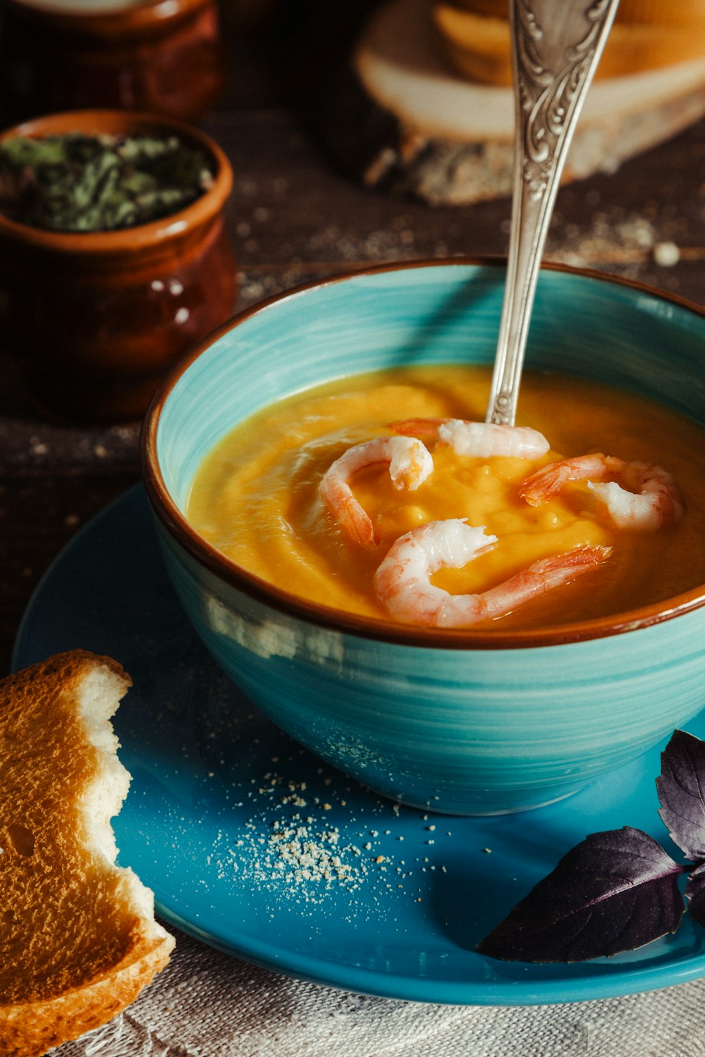 a bowl of soup with a spoon in it