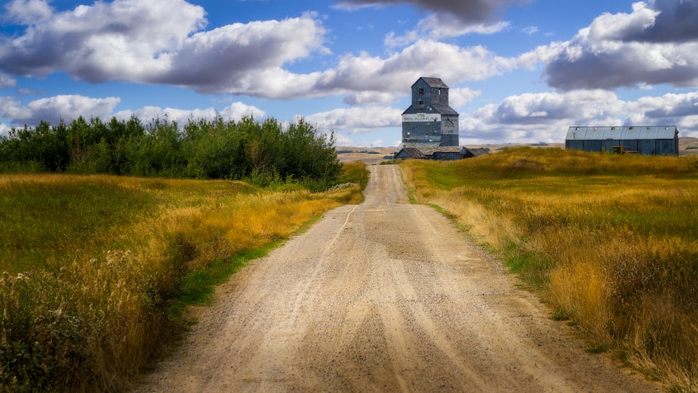 a train traveling down a dirt road