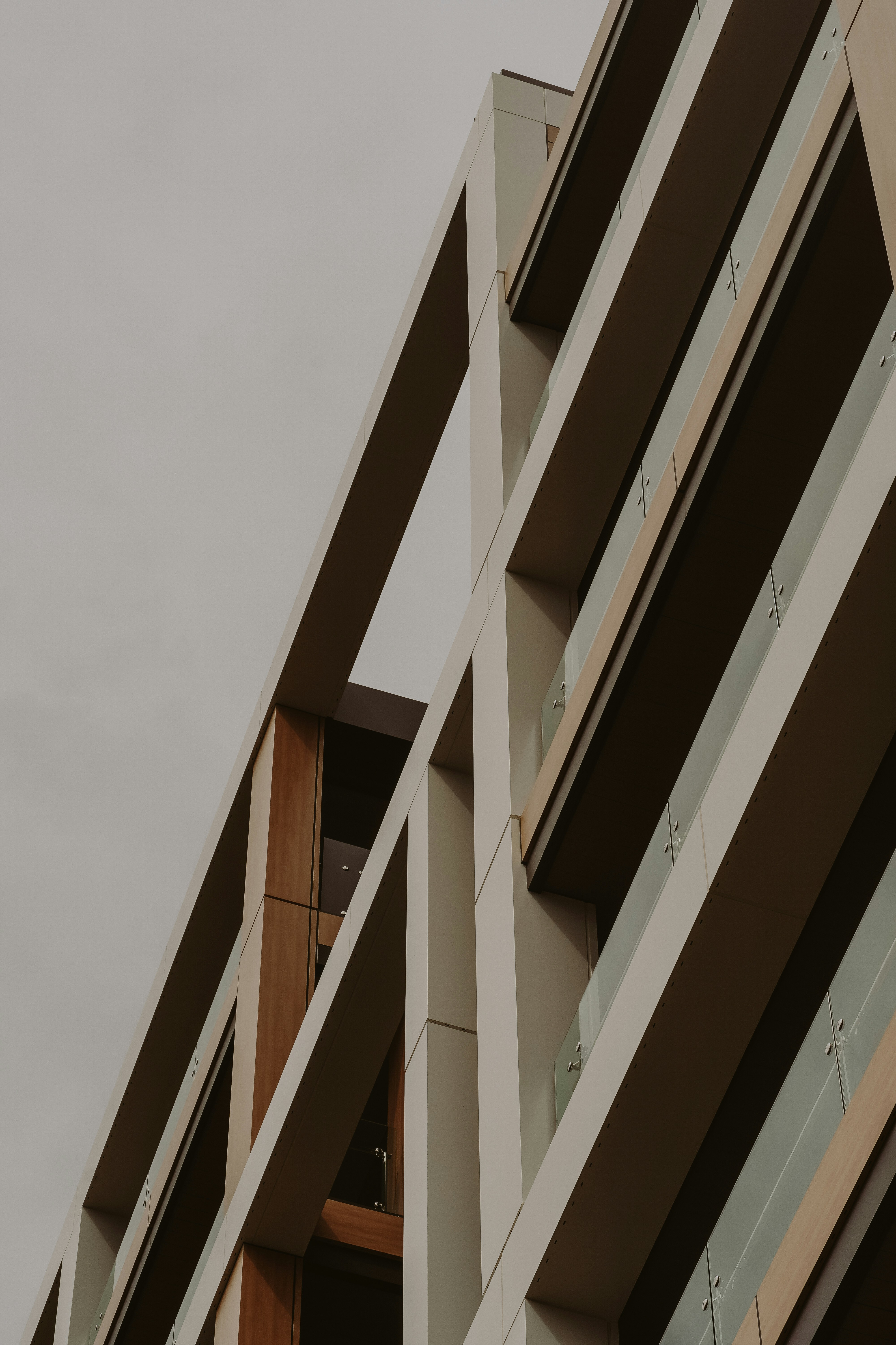 a tall building with multiple balconies and a clock