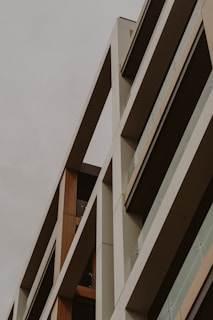 Modern residential building exterior showcasing clean lines and natural materials.