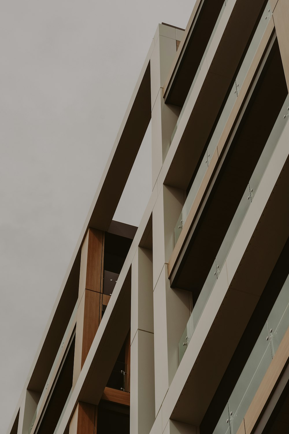 a tall building with multiple balconies and a clock