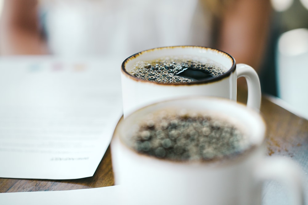 a close up of a cup of coffee on a table