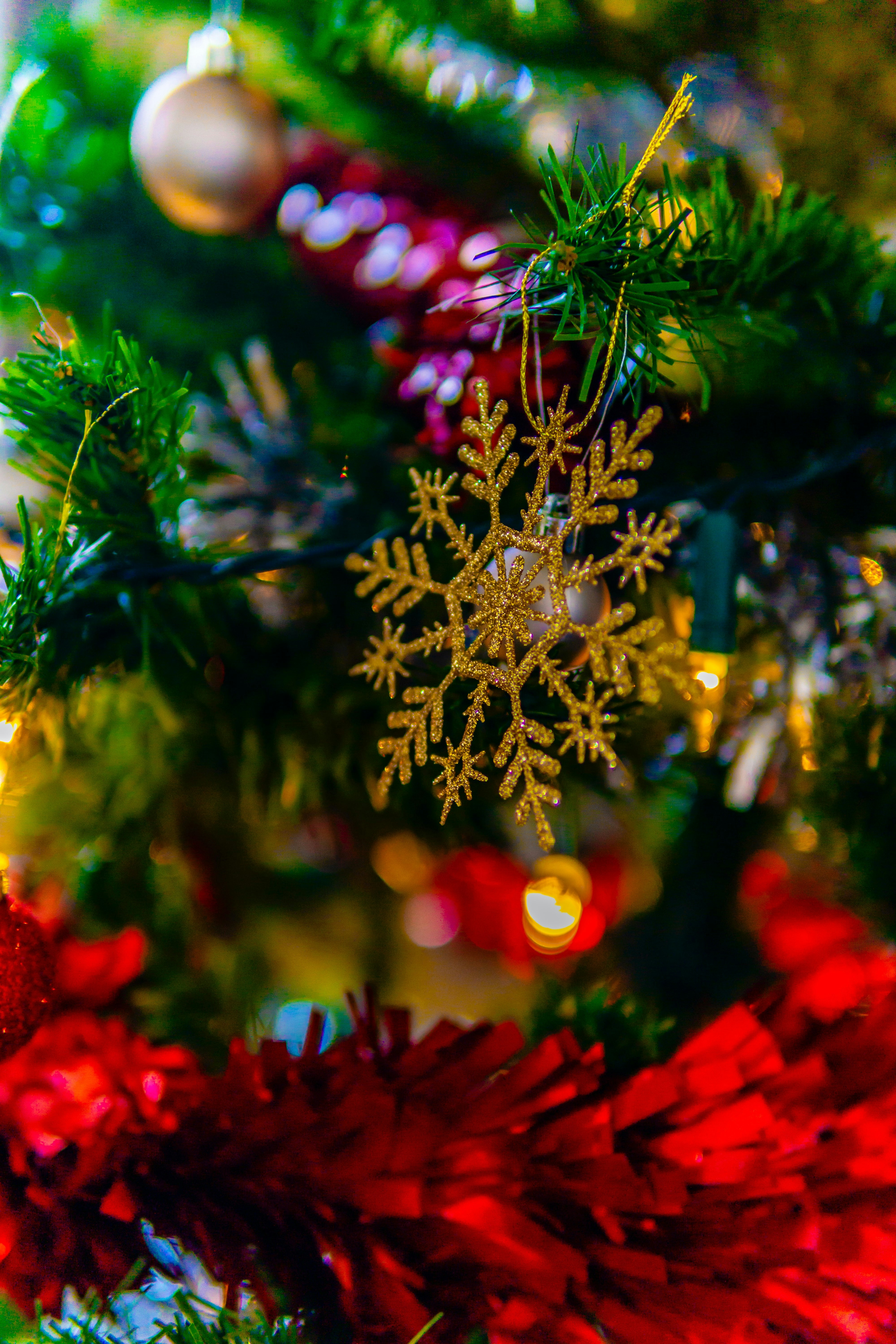 a close up of a christmas tree with ornaments