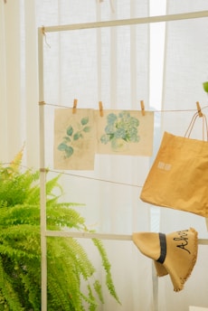 a pair of shoes hanging on a clothes line