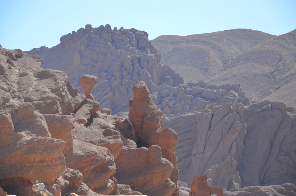 a man standing on top of a rock formation