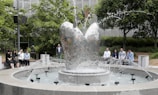 Neighbors gathered around the shared patio fountains, chatting and relaxing.