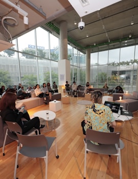 a group of people sitting in chairs in a room