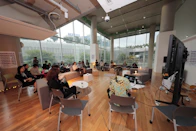 a group of people sitting in chairs in a room