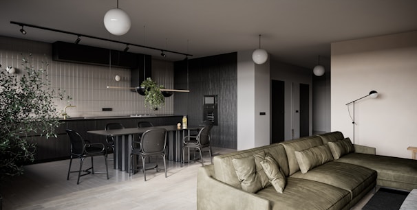 a living room filled with furniture and a bar