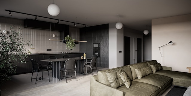 a living room filled with furniture and a bar