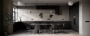 a dining room with a table and chairs