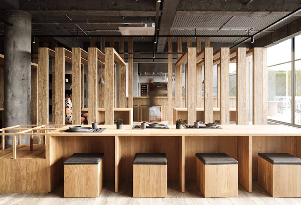 a room with a counter and stools in it