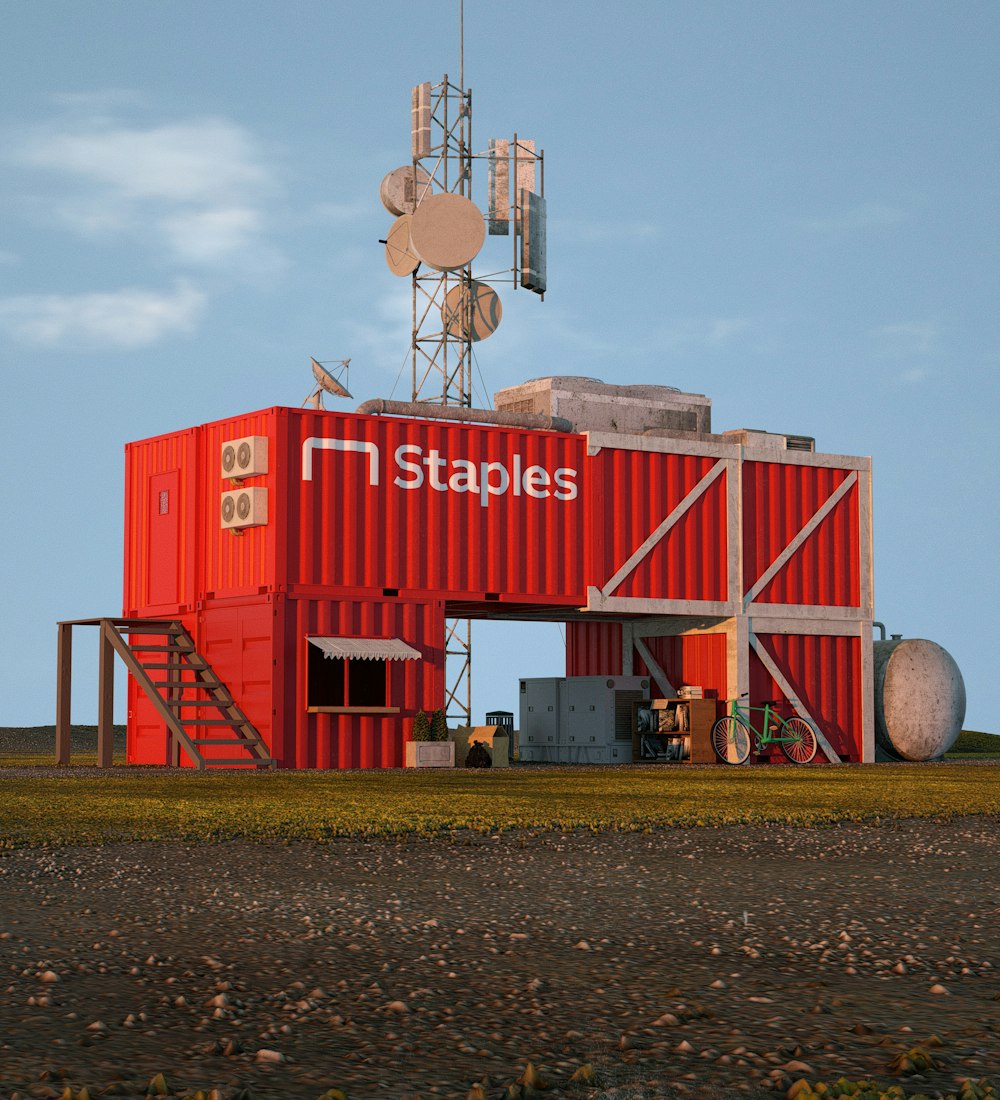 a red building with a radio tower on top of it