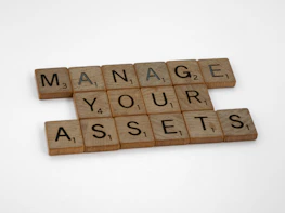 scrabble tiles spelling manage your asset