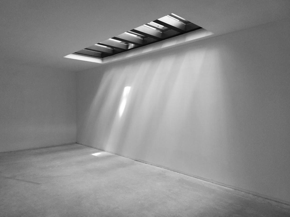 an empty room with a skylight in it