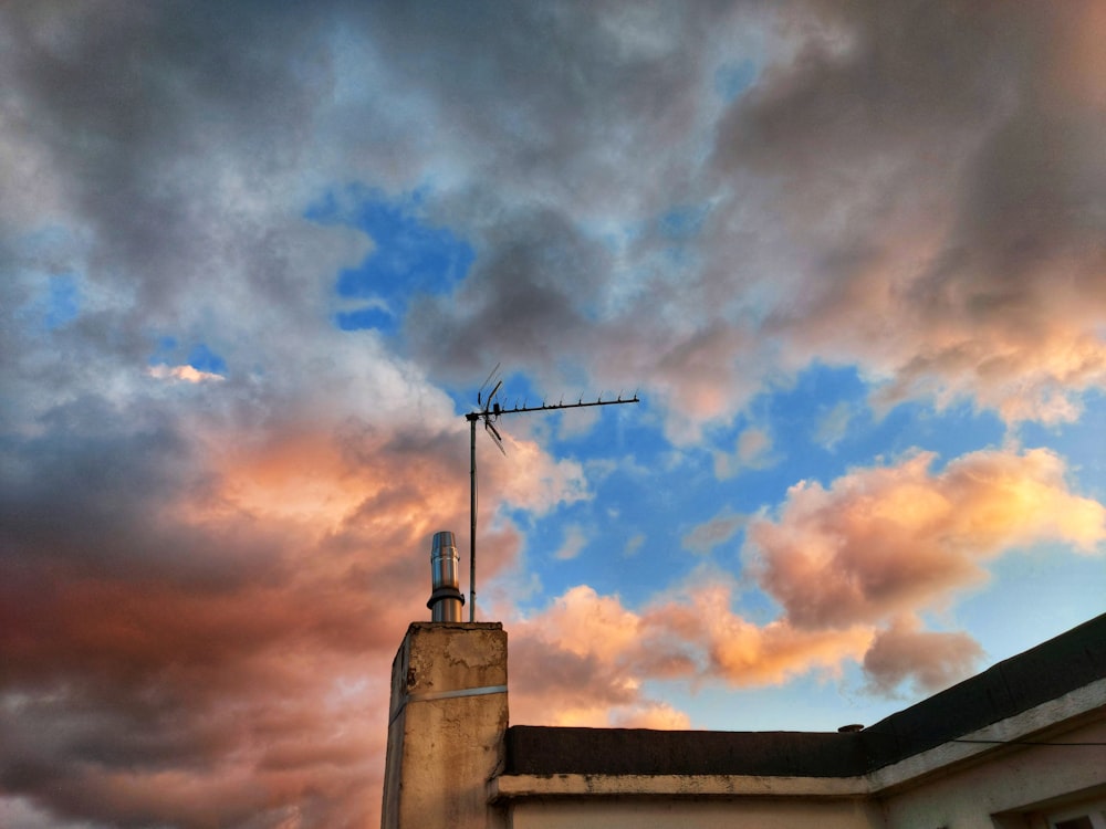 a building with a weather vane on top of it