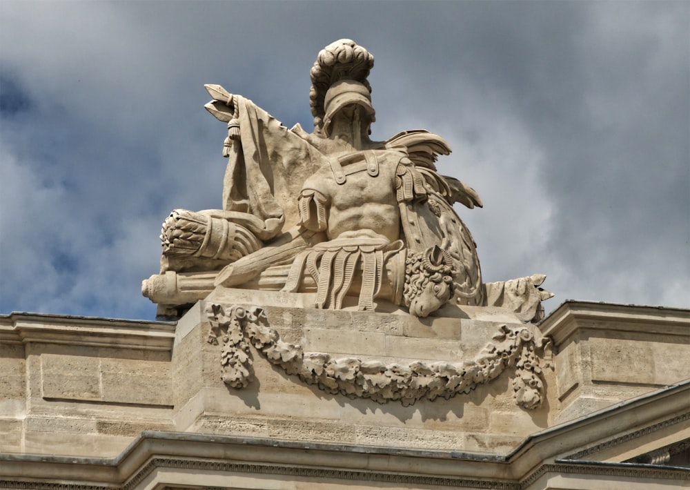 a statue of a man on top of a building