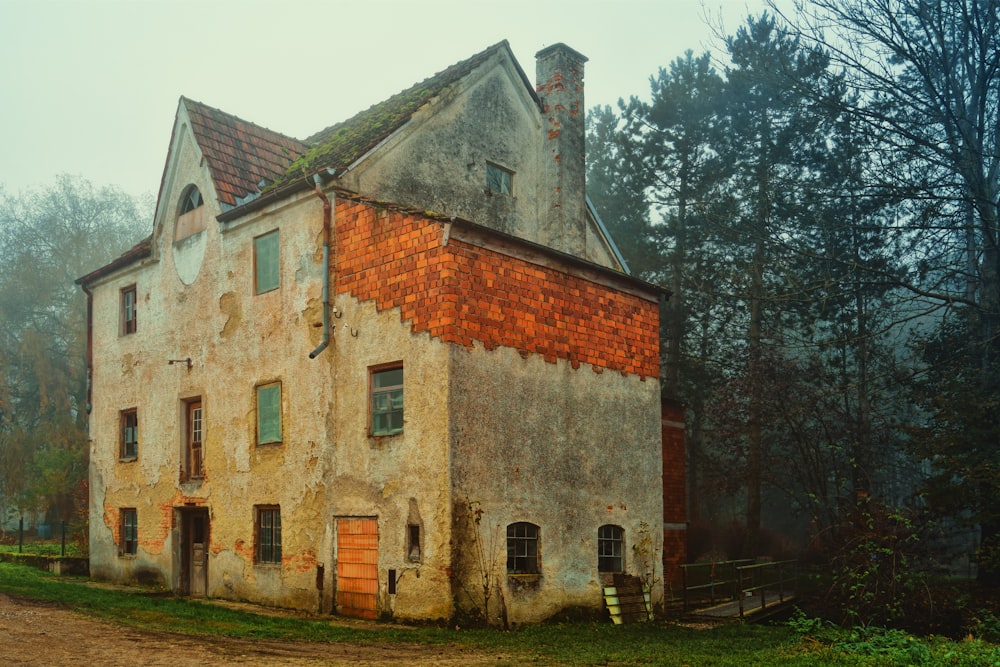 an old house with a red brick roof