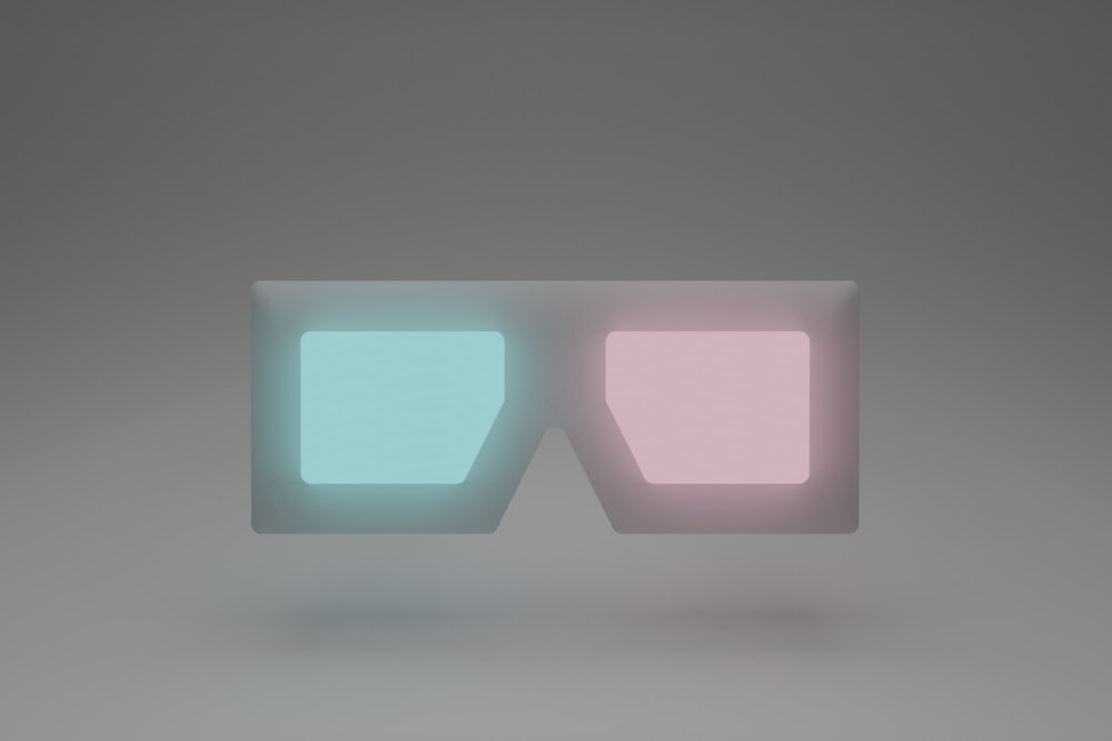 a pair of glasses sitting on top of a table