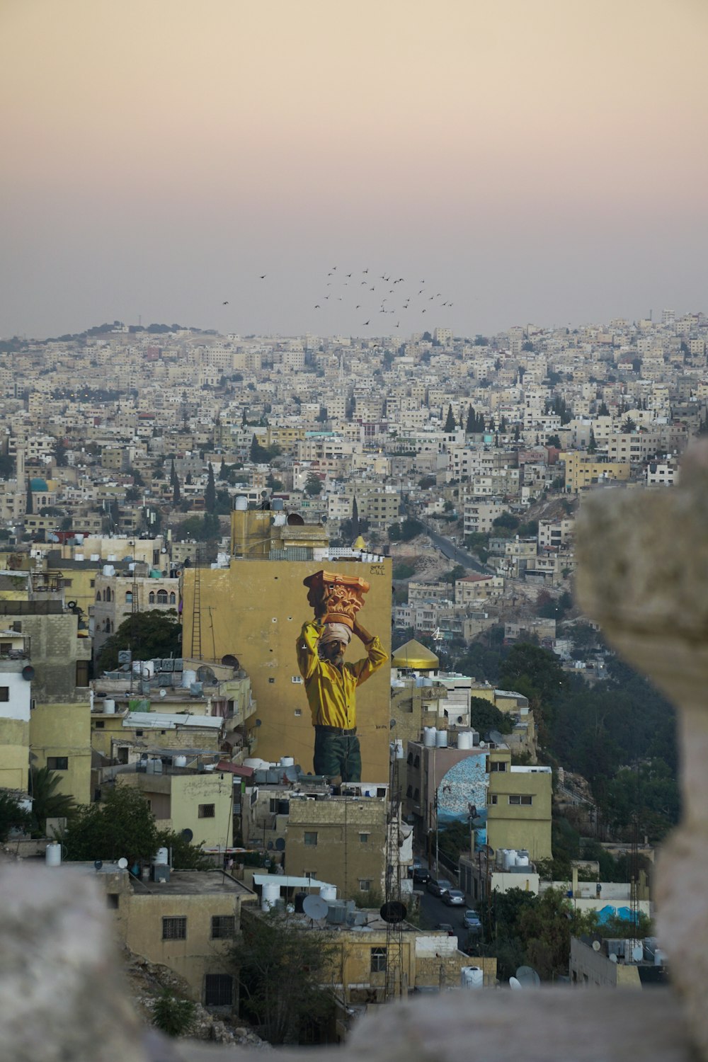 a large mural of a man on the side of a building