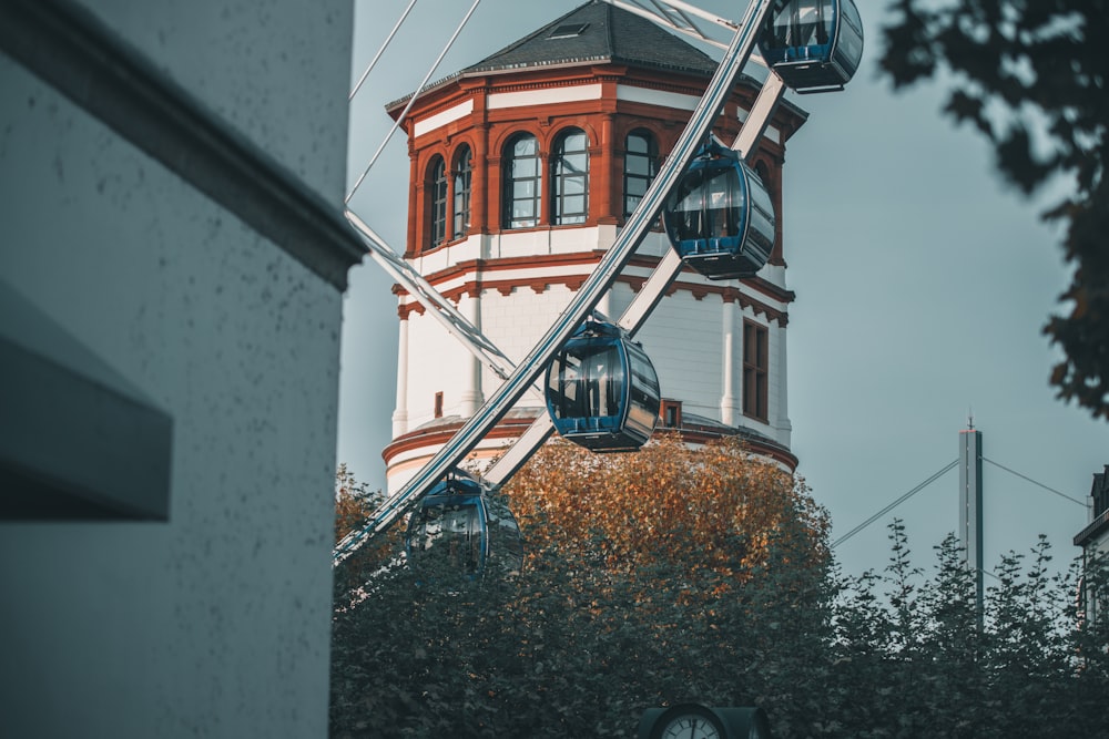 a ferris wheel sitting in front of a building