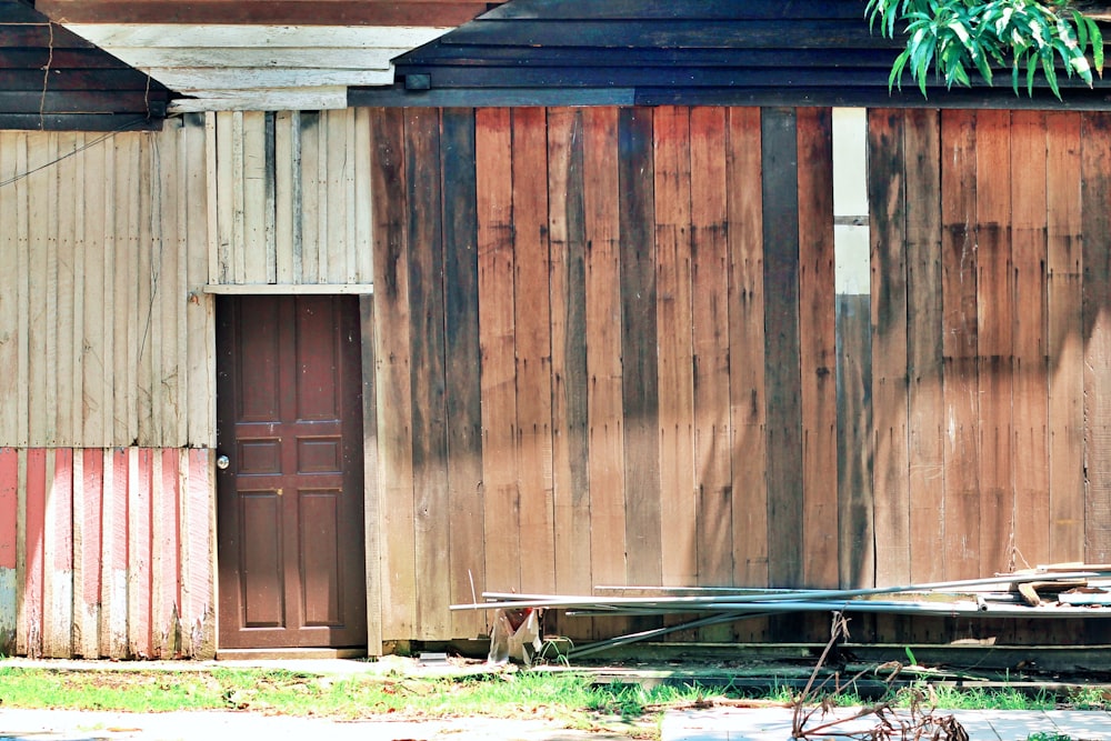 a horse standing in front of a wooden building