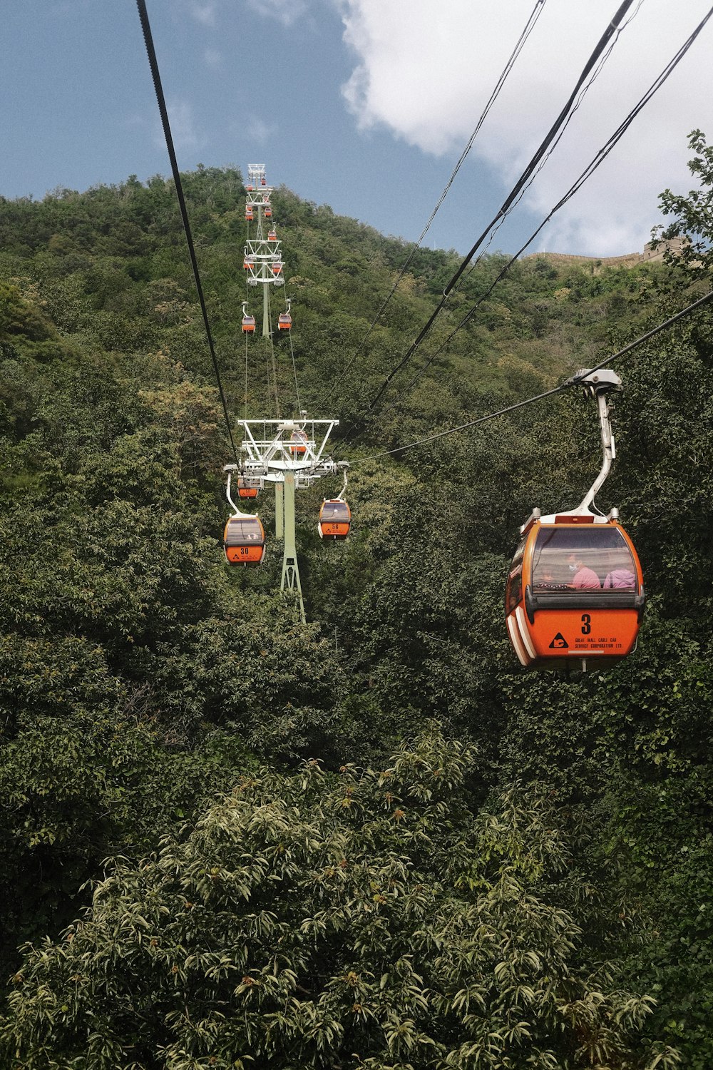 a couple of gondolas that are in the air