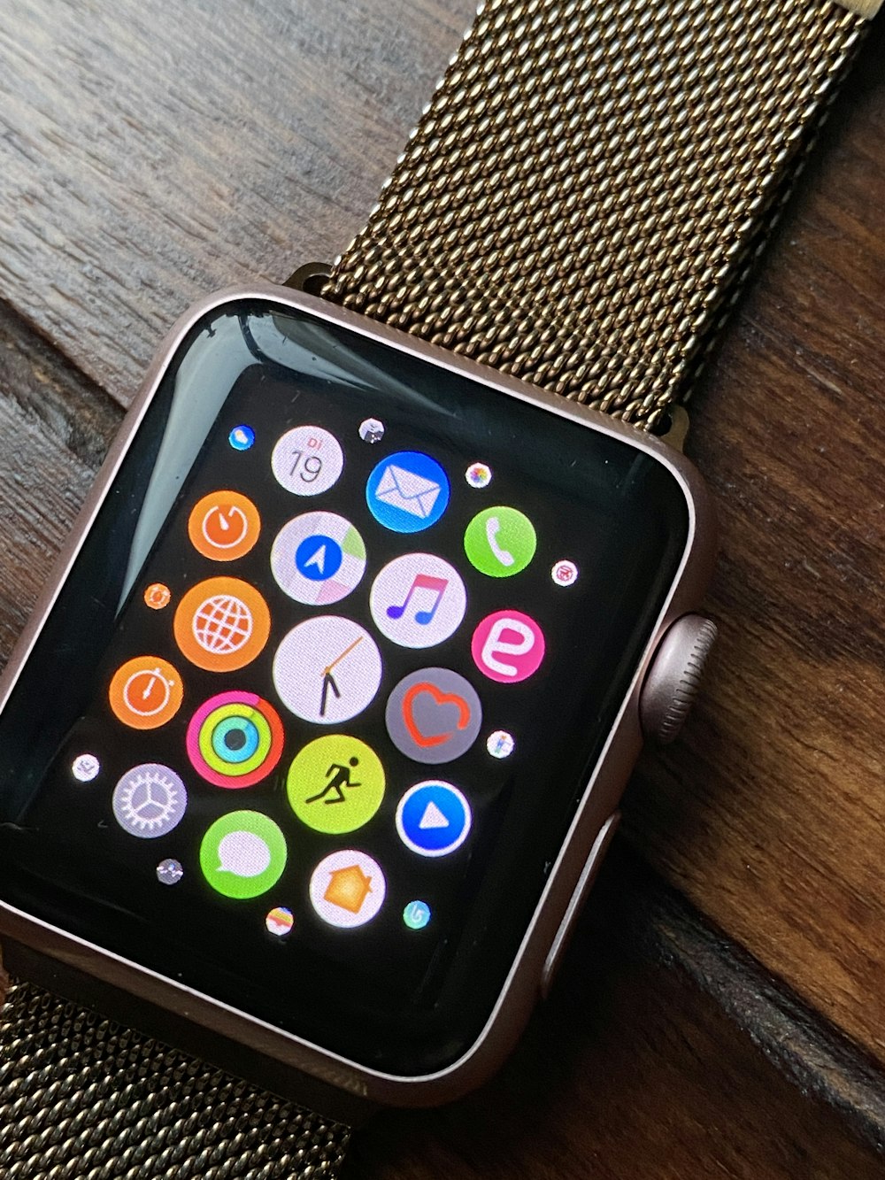 a smart watch sitting on top of a wooden table