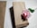 Close-up of elegant, eye-catching paper bags arranged neatly on a rustic wooden table.