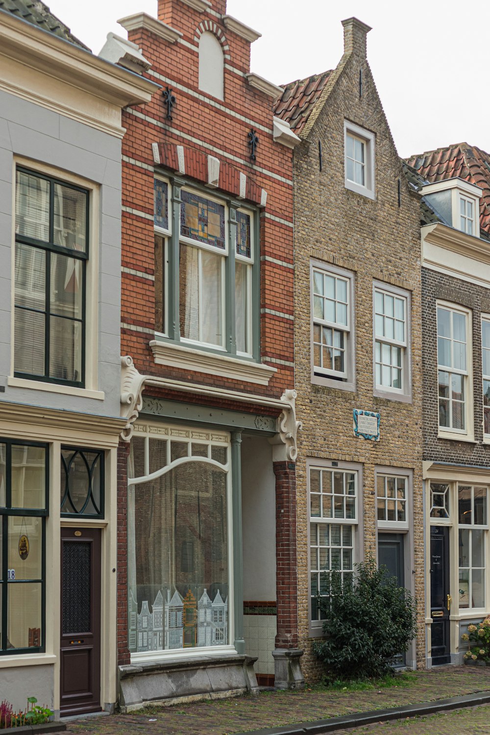 a row of brick buildings on a street