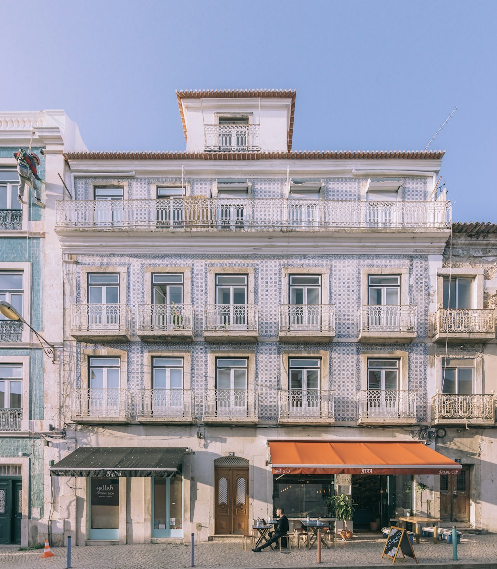 a building with a red awning in front of it