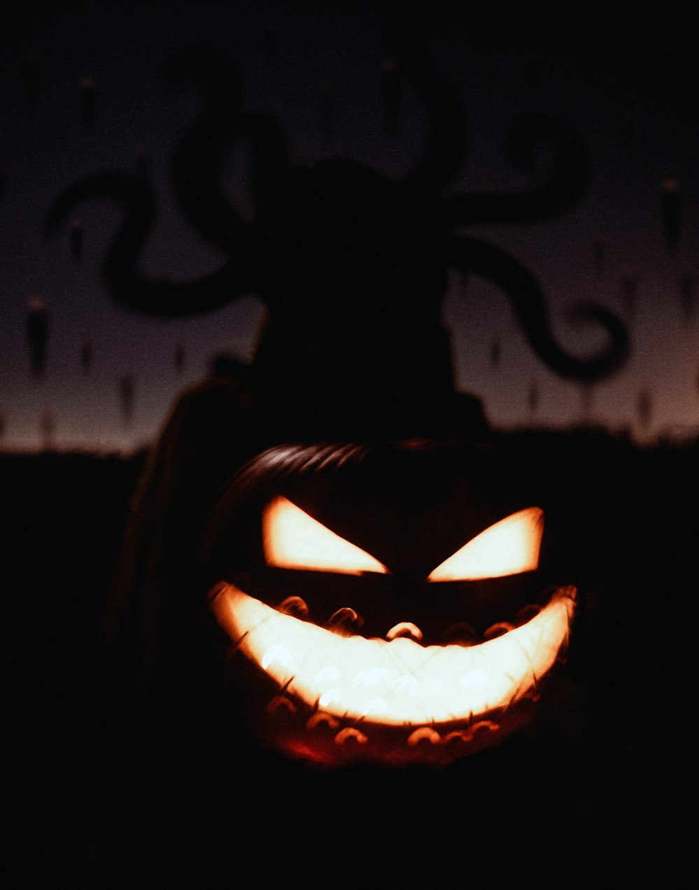 a carved jack o lantern in the dark