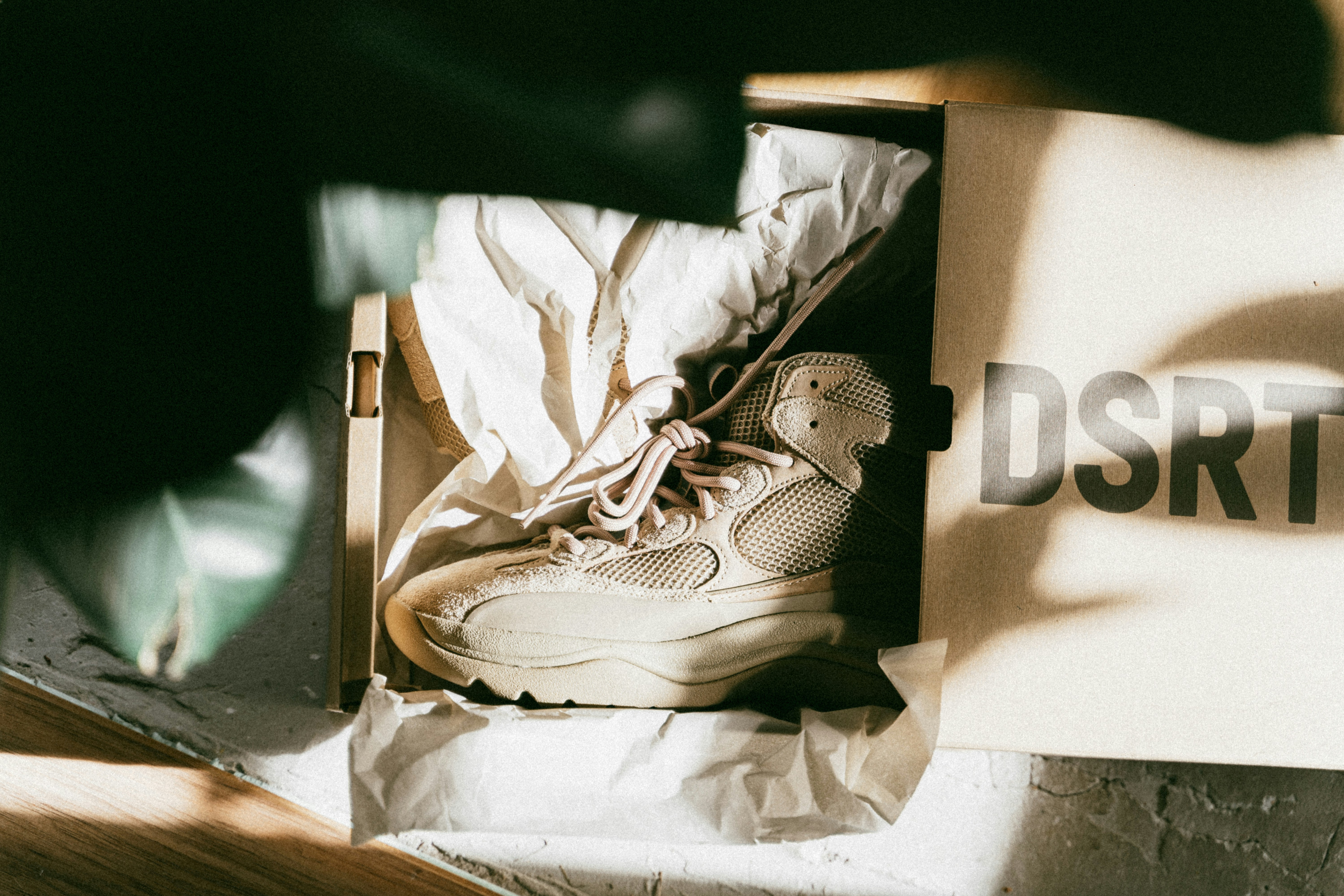 a box with a pair of shoes inside of it