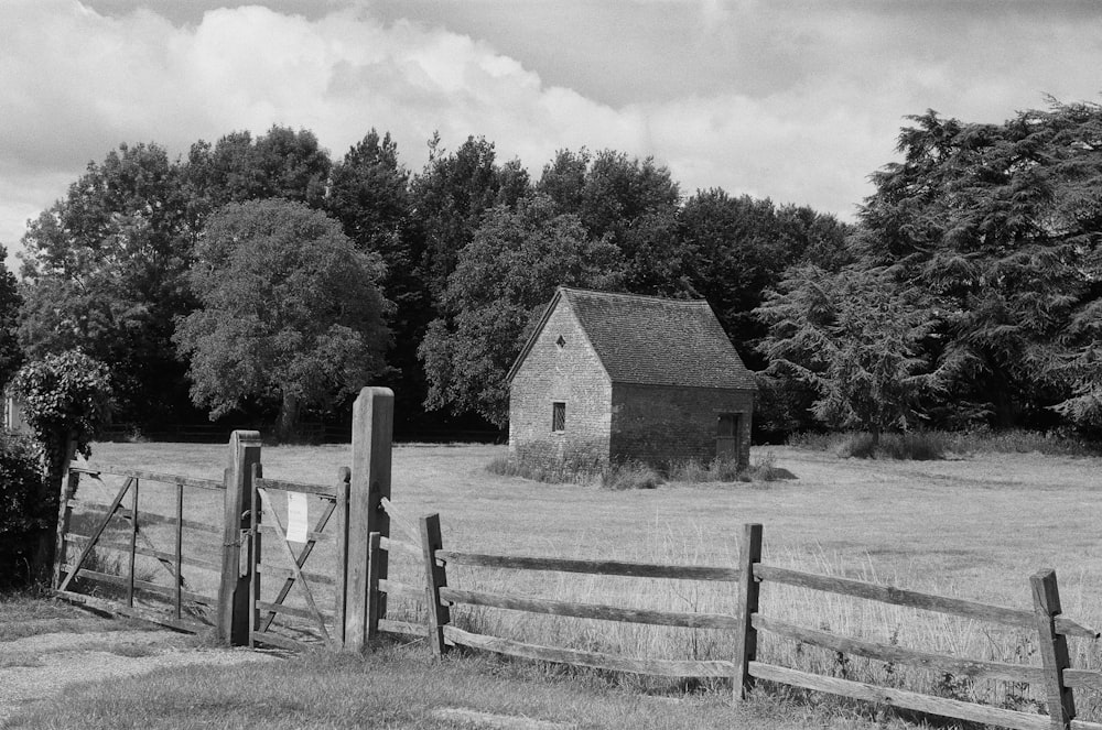 a black and white photo of a farm house