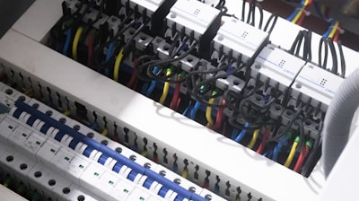 a bunch of wires are plugged into a switch box